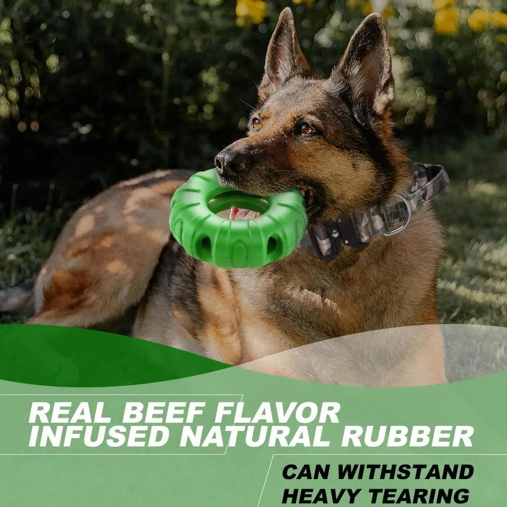 Blue natural rubber tyre-shaped dog chew toy with six oval openings, shown next to a red and green version.