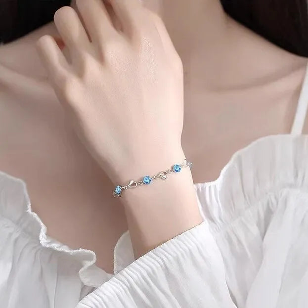 Blue heart pendant necklace and bracelet set with mixed gem inlay on geometric copper jewellery