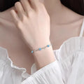 Blue heart pendant necklace and bracelet set with mixed gem inlay on geometric copper jewellery