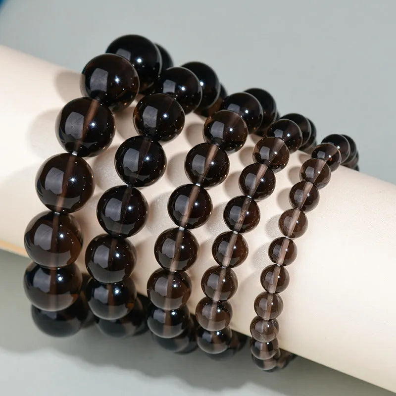 Hand-woven obsidian couple bracelet with year of birth symbols in ethnic style design