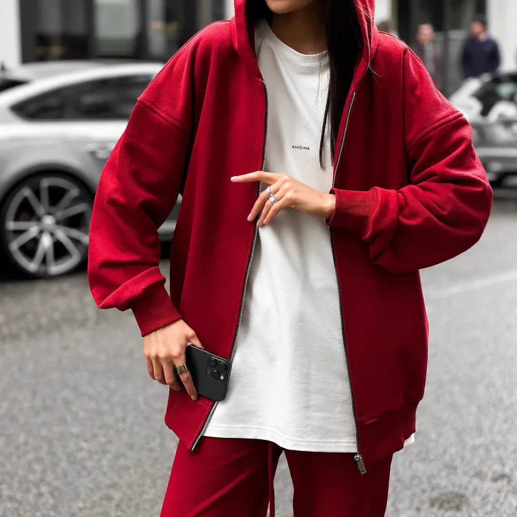 Red loose fit street style two-piece set with long sleeve coat and trousers on a rack