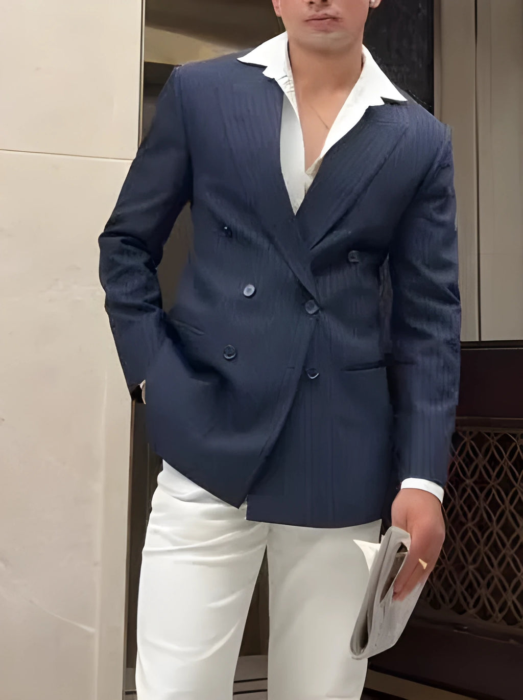 Men's striped double-breasted polyester blazer showing regular fit and traditional styling