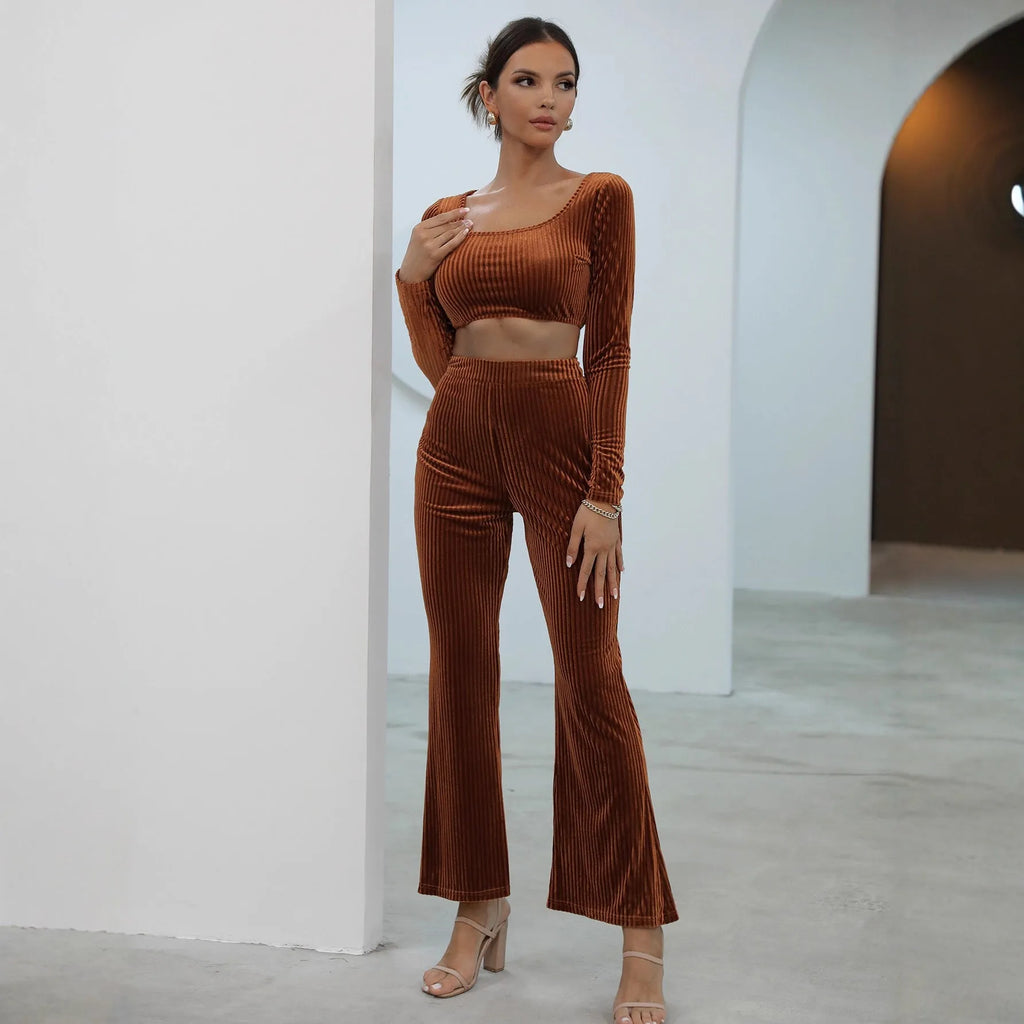 Caramel coloured women's long sleeve sweater and loose trouser co-ord set on a hanger