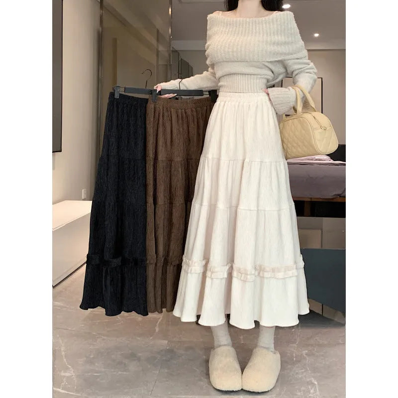Women's corduroy A-line midi skirt with elastic waistband in milky white, black, and brown colours