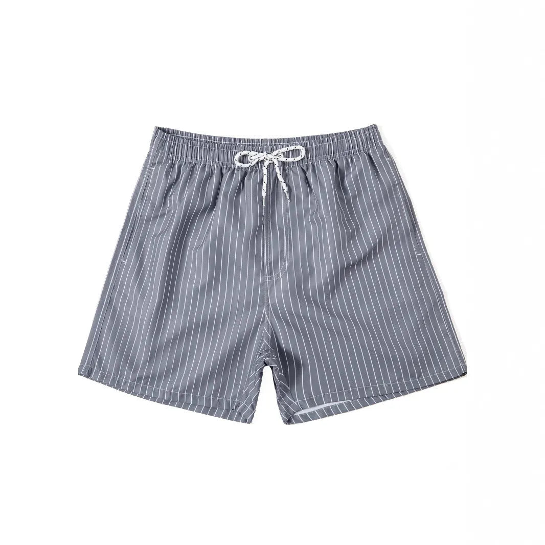 Men's striped polyester beach shorts in light blue with straight leg cut