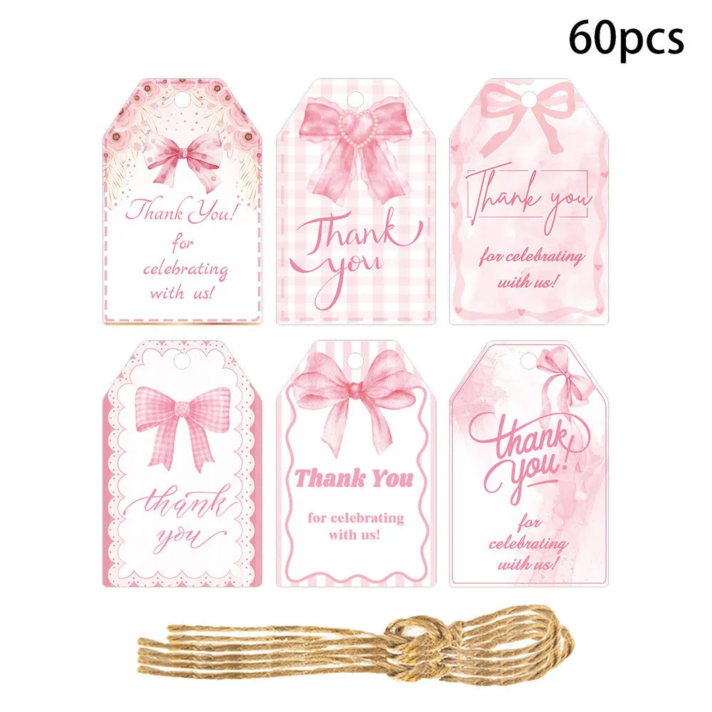 Set of 60 decorative bowknot-shaped paper gift tags with natural jute twine for birthdays.