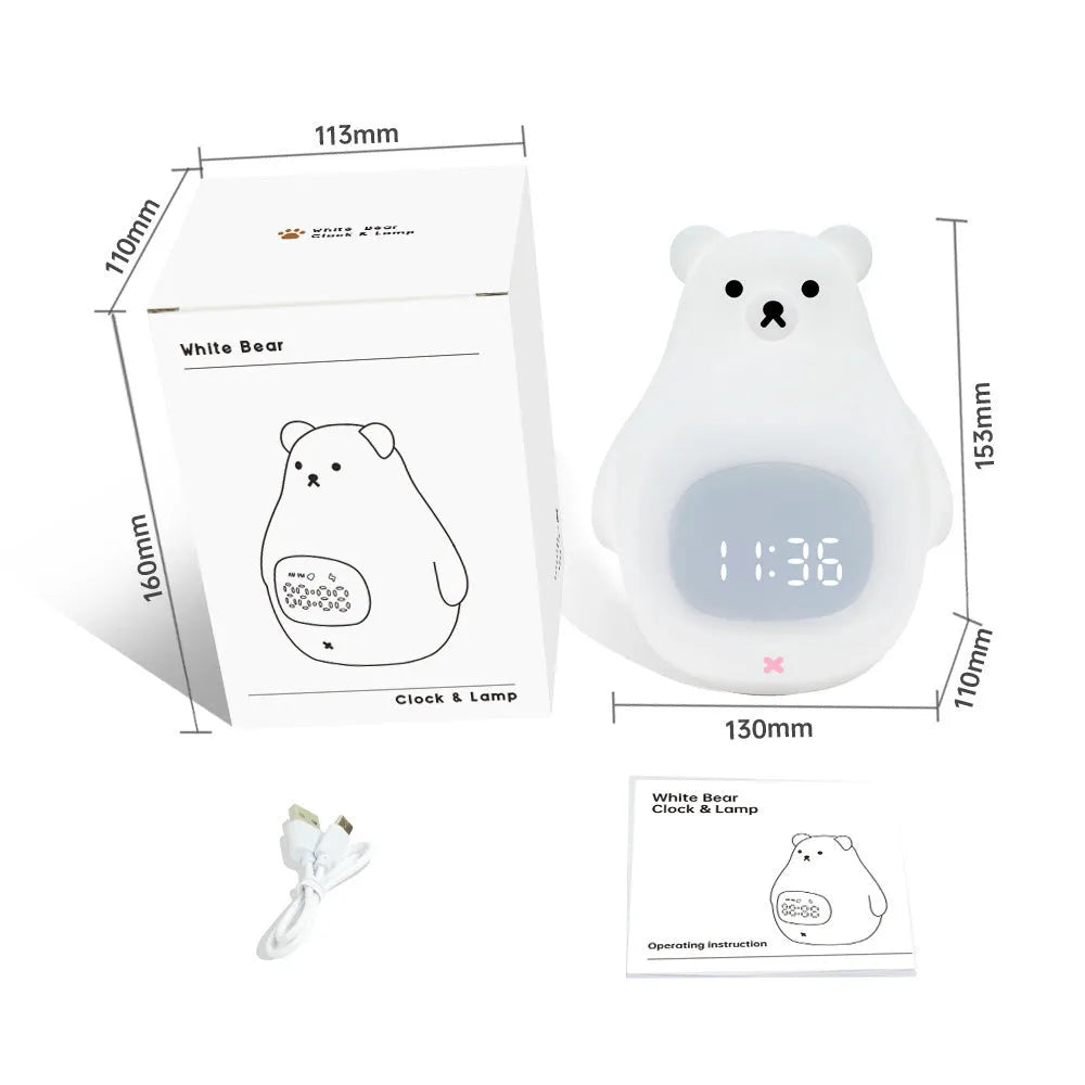 White silicone bear-shaped night light with a remote control on a wooden surface.