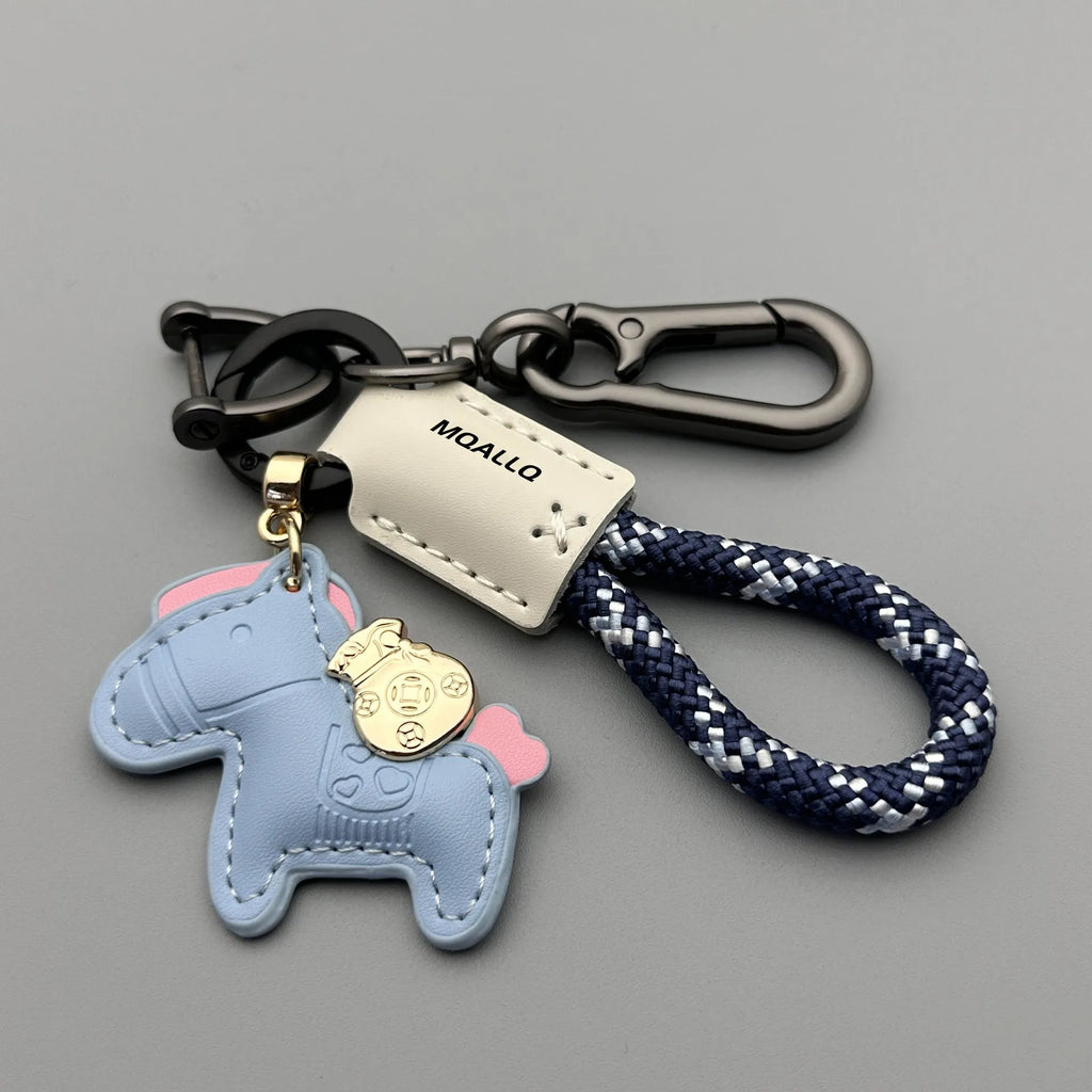 Zinc alloy car keychain pendant with a strap made of brown cowhide and green flannel rope.