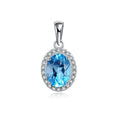 Geometric blue topaz and sterling silver four-piece jewellery set with earrings, ring, pendant, and necklace.
