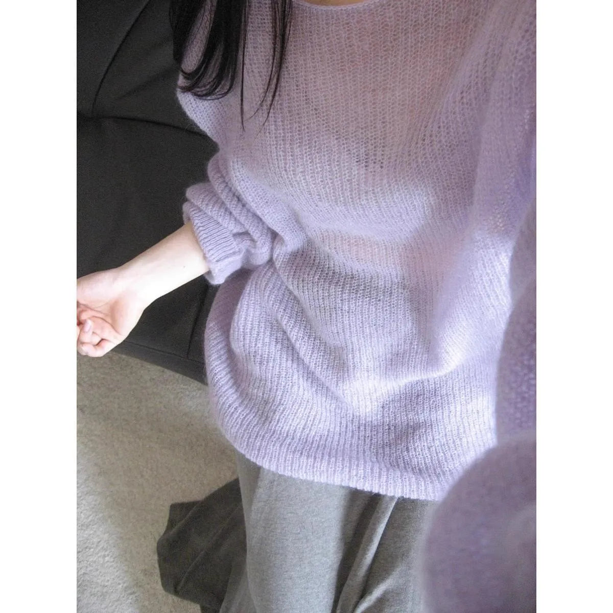 Purple women's blouse with hollow out pattern and princess sleeves on mannequin