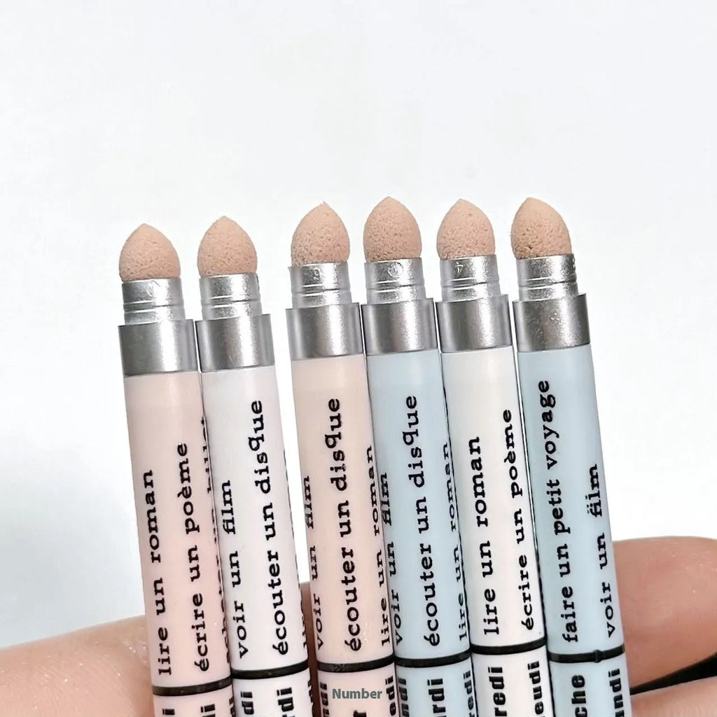 Waterproof brightening eyeshadow pen in one of six shade variations on a white background.