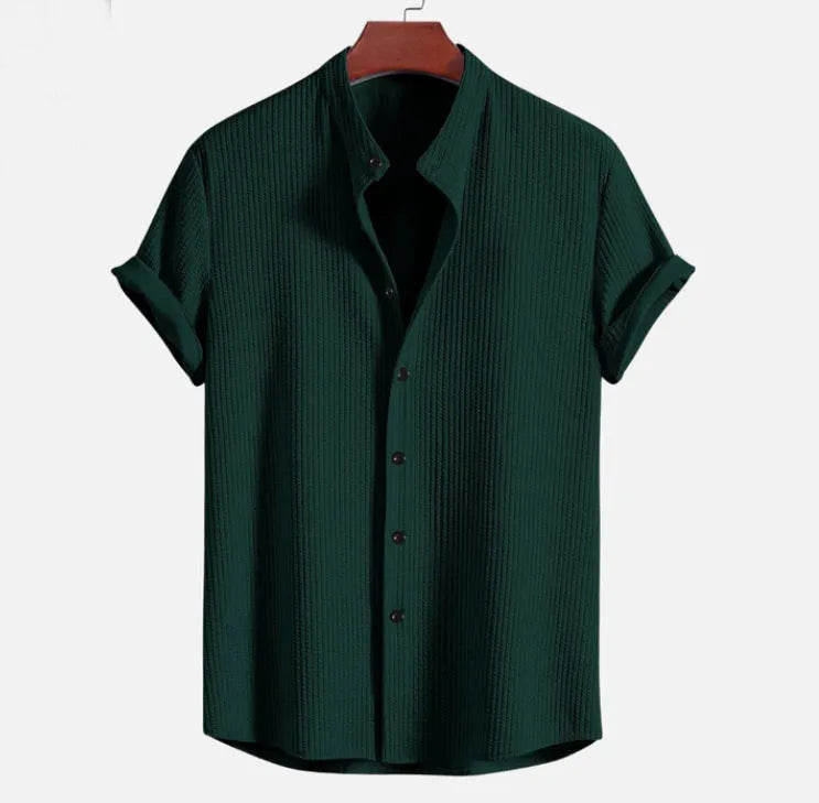 Man wearing a loose-fit short sleeve casual shirt in a solid colour, available in multiple sizes.