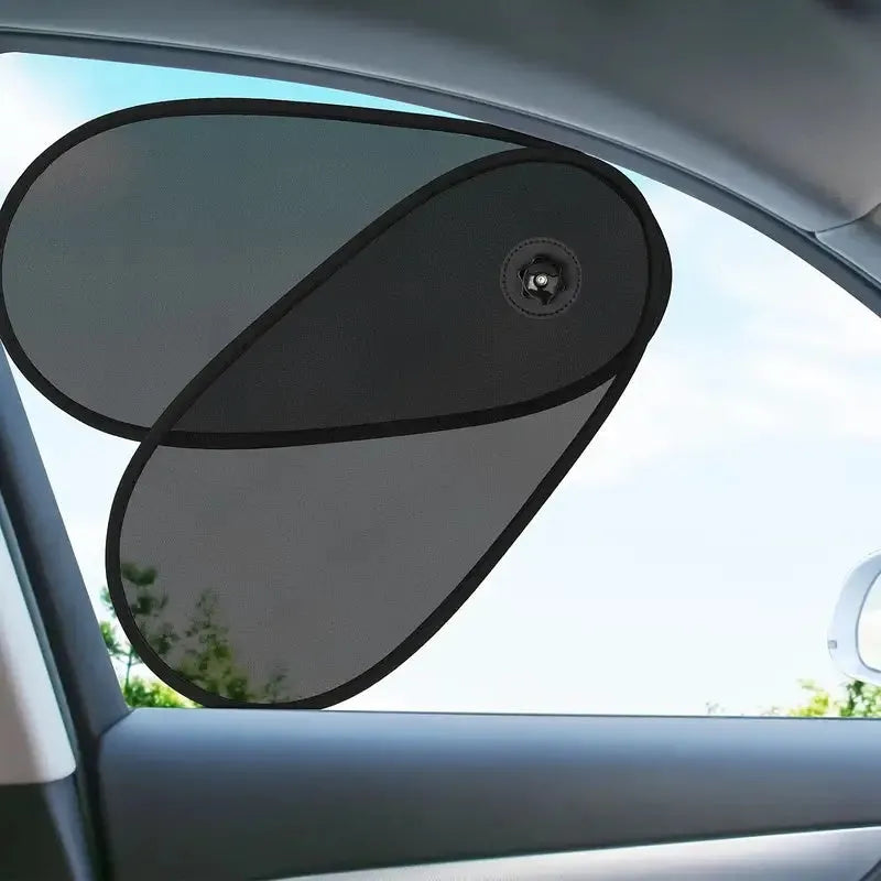 Black breathable mesh car side window shade stretched over glass with visible suction cups.