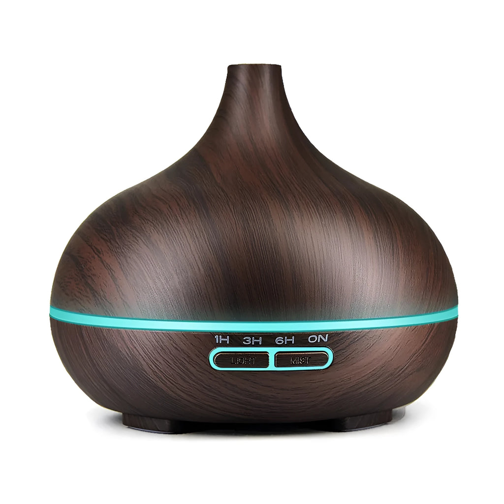 Round 550ml ultrasonic aromatherapy humidifier in white with mechanical control on desk