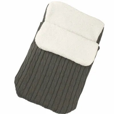 Envelope-style baby stroller sleeping bag in a choice of colours with cotton wool filling.
