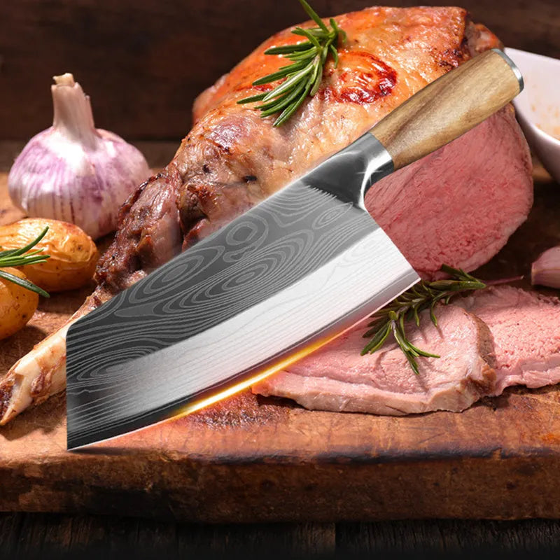 A stainless steel kitchen knife with a 320mm blade on a kitchen counter.