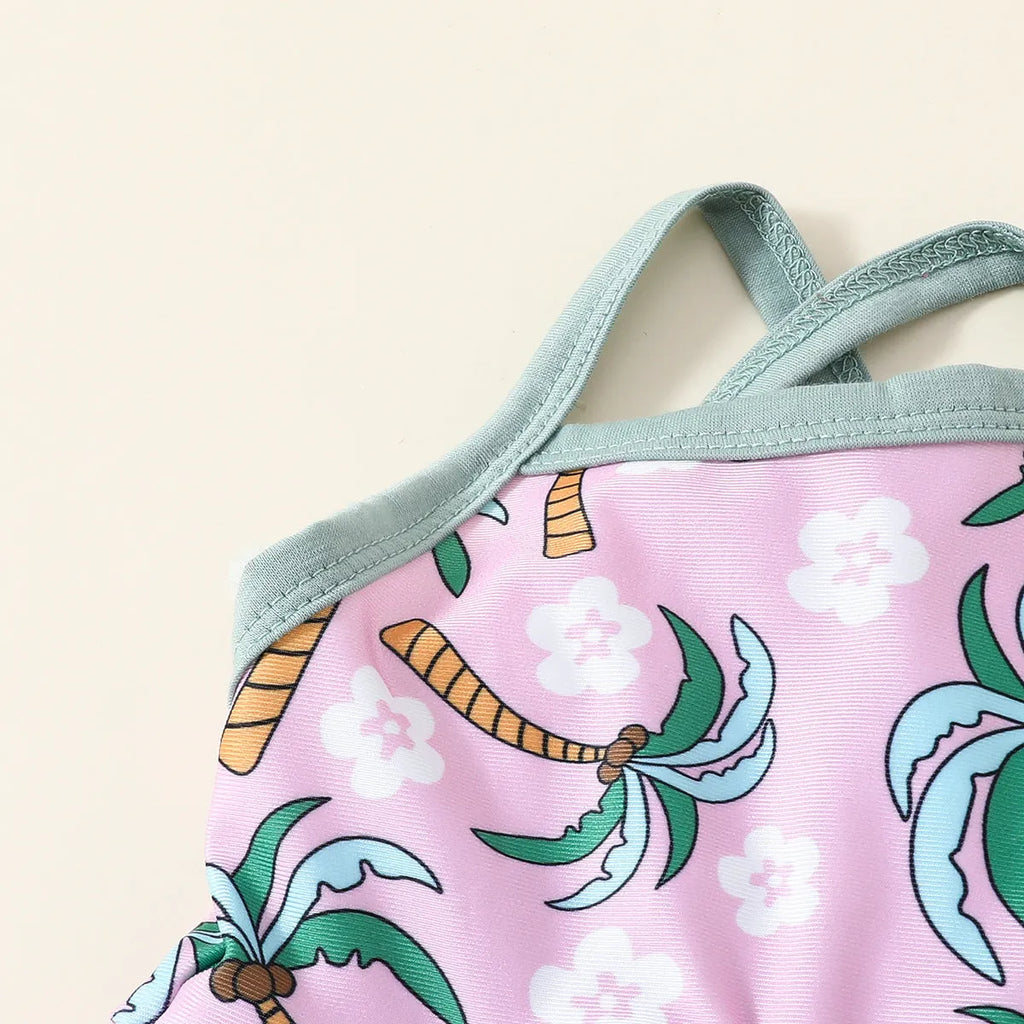 White children's two-piece swimsuit set with shirt and beach shorts on hanger
