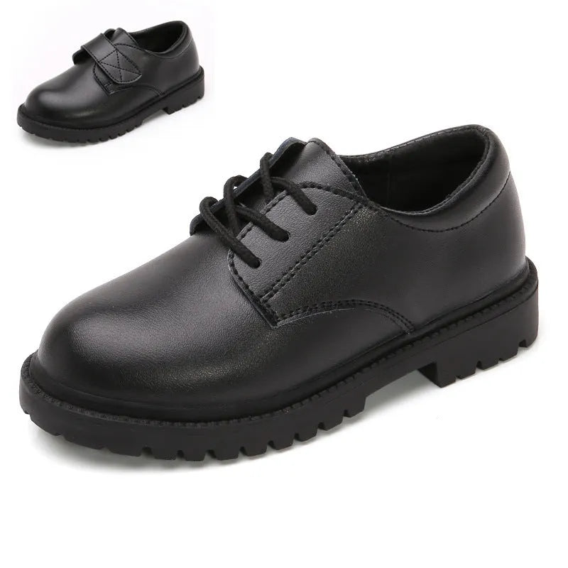 School designated black dance shoes with rubber sole and low top design for children