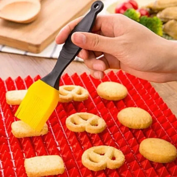 Red silicone pyramid grid cooking mat for oven and BBQ use