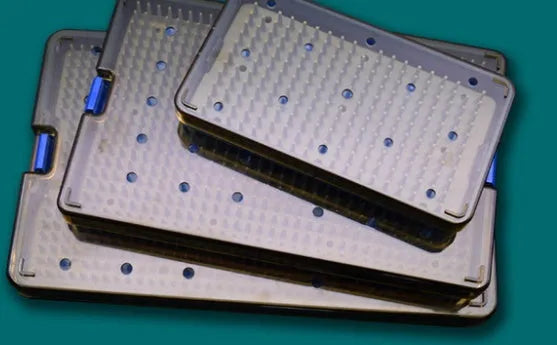 Clear silicone disinfection box in large size next to a mobile phone and keys.
