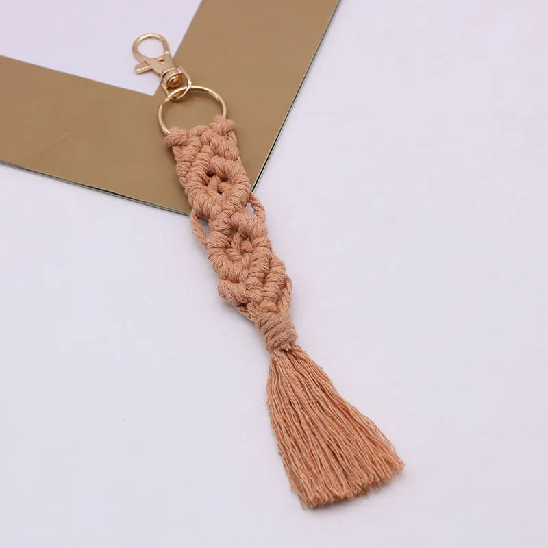 Hand-woven cotton tassel key chain in eight colours including brick red and rose pink for car keys and bag ornaments
