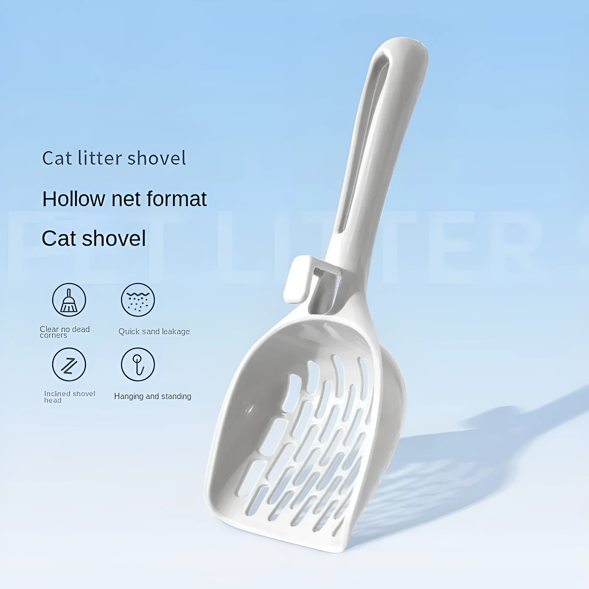 Grey plastic cat litter scoop with attached stand, shown next to a litter box.