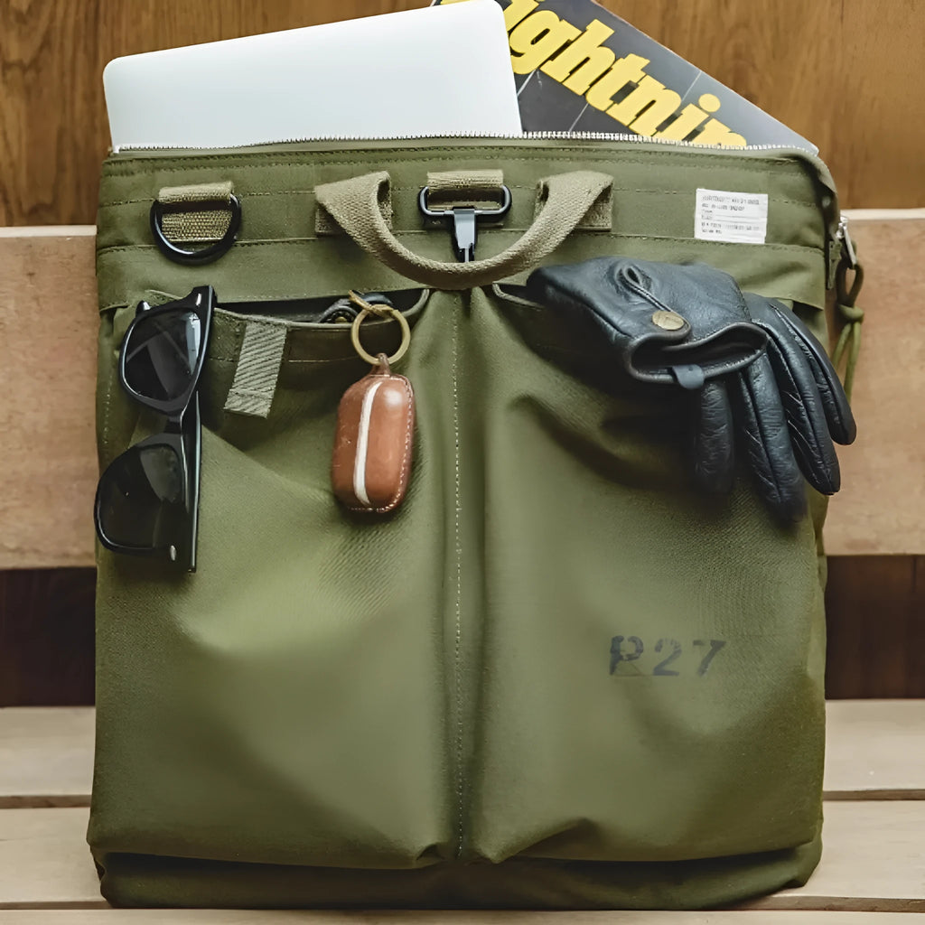 Marden Tooling charcoal black canvas messenger bag with crossbody strap, shown open to reveal laptop compartment.