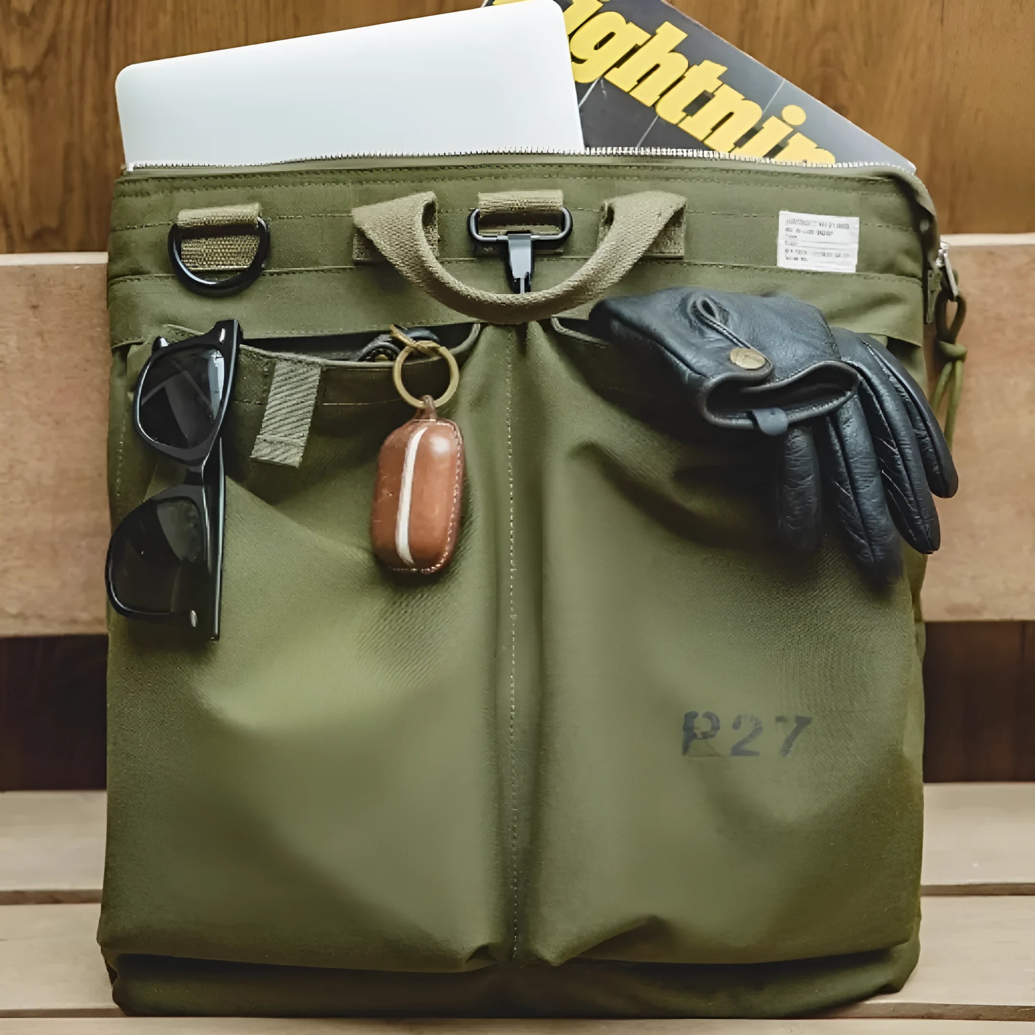 Marden Tooling charcoal black canvas messenger bag with crossbody strap, shown open to reveal laptop compartment.