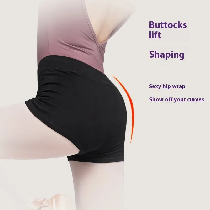 Black cotton dance shorts for women laid flat, showing solid colour and simple design for ballet practice.
