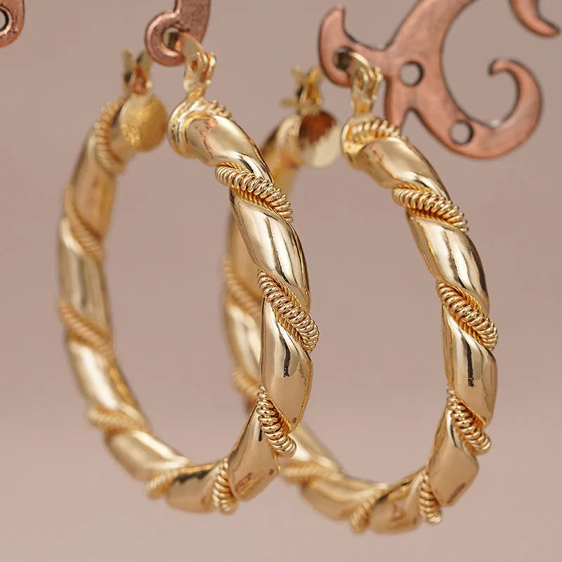 Geometric copper women's earrings with ring and line elements in golden colour