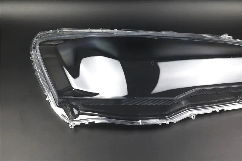 Transparent plastic headlight housing cover for vehicle replacement measuring 50x30x20mm