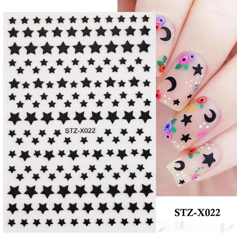 Pack of black and silver strip nail art stickers with cartoon and love pattern designs.