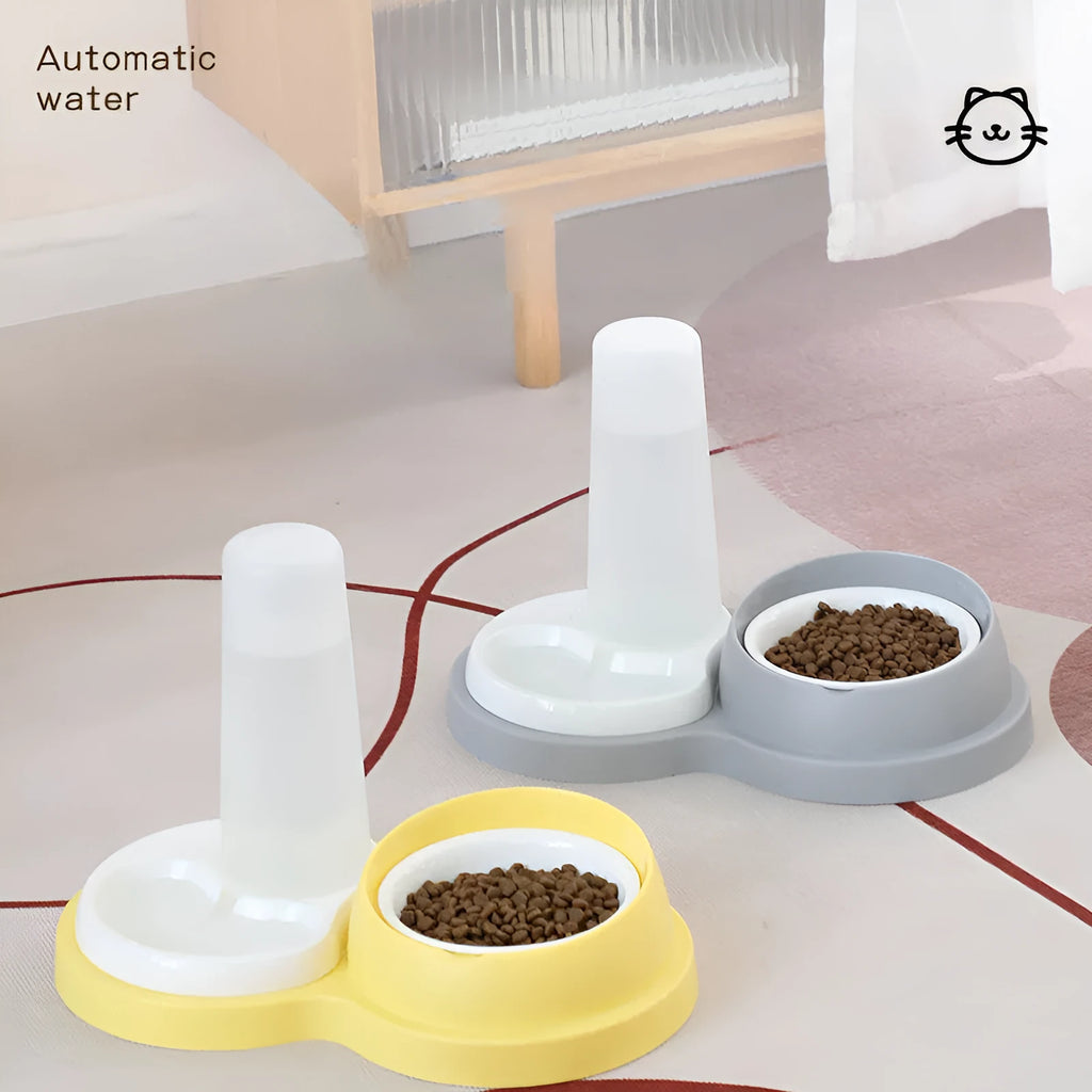 Grey and yellow dual pet feeding bowl with raised neck support and separate food and water compartments.