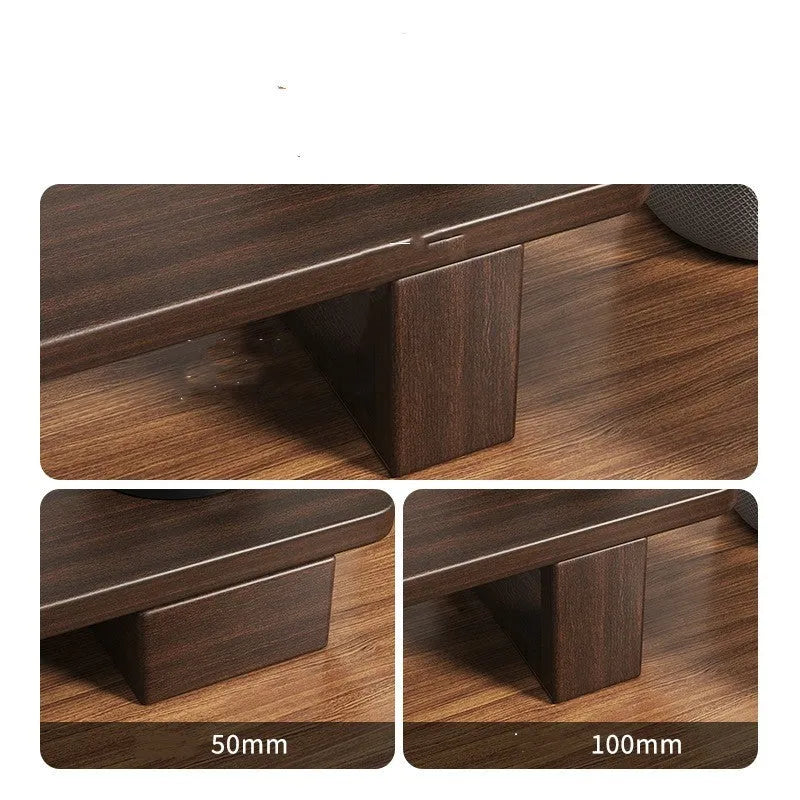Solid walnut wood computer monitor heightening frame on a wooden desk with a keyboard stored below