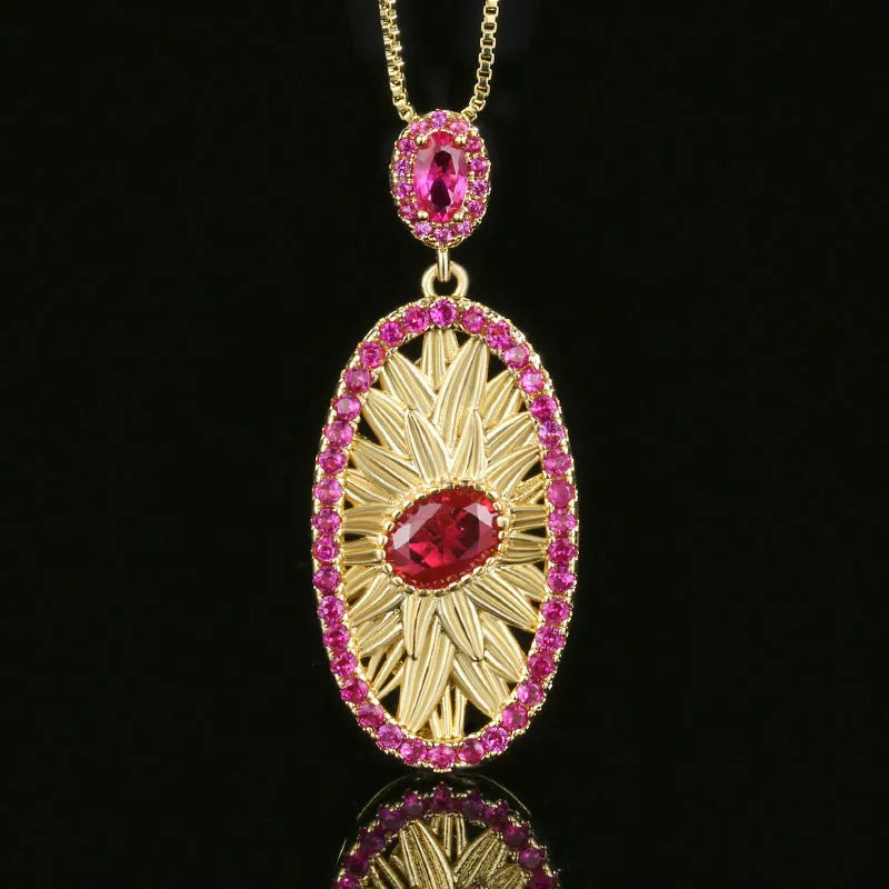Gold-plated red corundum jewellery set showing necklace, ring and ear studs with diamond-cut water drop design