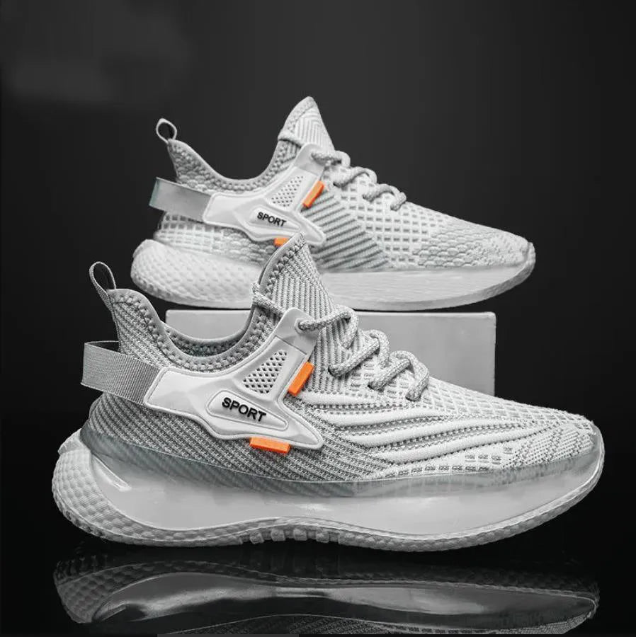 Men's white low-top platform sneakers with mesh upper and flat rubber sole on a plain background.