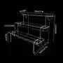 Transparent acrylic cosmetics storage rack with detachable shelves, displaying perfume bottles and small accessories