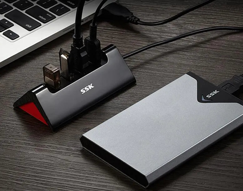 Black USB expansion dock with four ports and multiple cable length options for computer connectivity