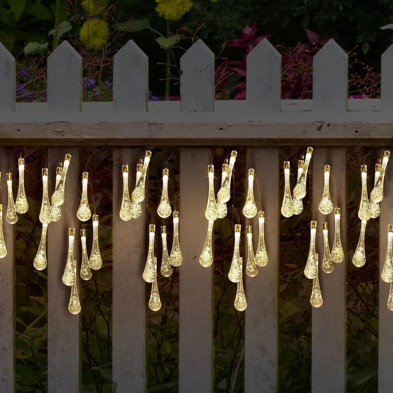 Solar-powered LED string lights with bubble drop pendants on 6.5 metre cable for outdoor garden decoration