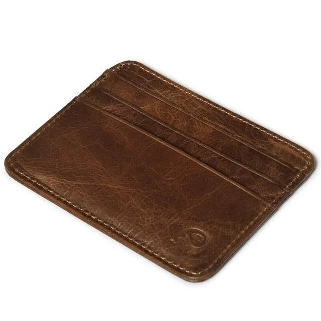 Genuine leather magic wallet in brown, open to show 27 card slots, money clip, and ID window