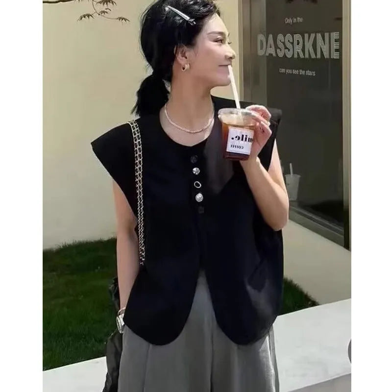 Women's loose-fit short polyester vest in milky white with pocket detail.