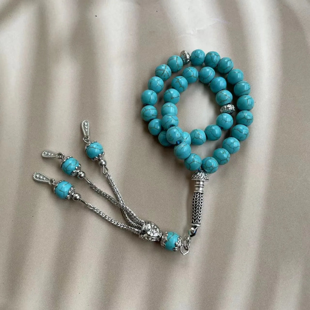 Handmade sky blue stone Muslim prayer bracelet with 8mm beads on a wrist.