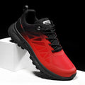 Men's black and orange mesh running shoes with round toe and lace-up front
