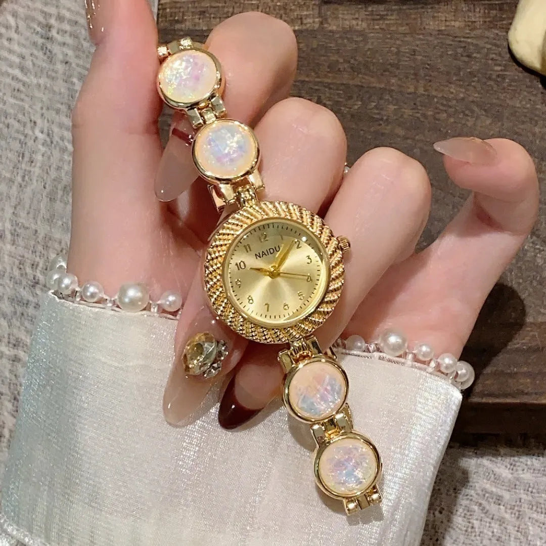 Women's quartz watch with 25mm round dial in zinc alloy case, showing spiral crown
