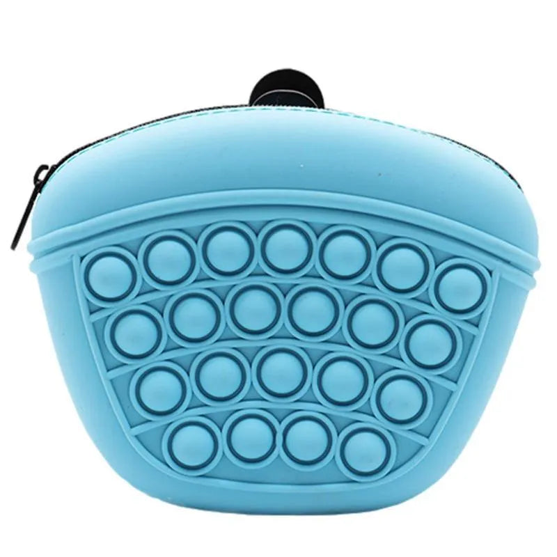 Blue silicone dog training treat pouch with magnetic closure and waist clip on a belt
