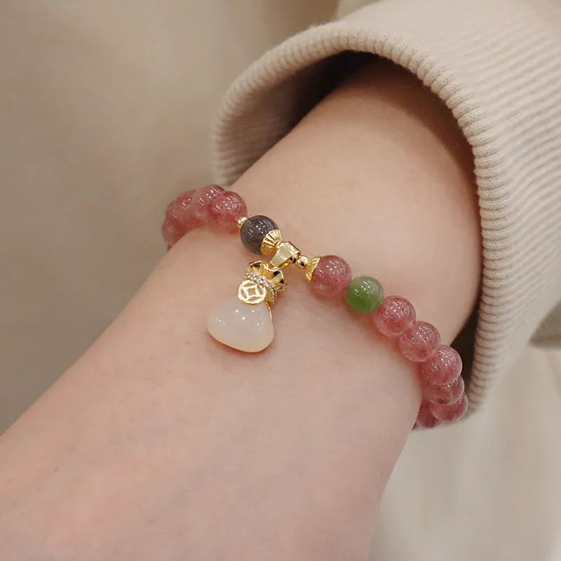 Pink strawberry quartz purse bracelet with geometric shapes and safety buckle closure