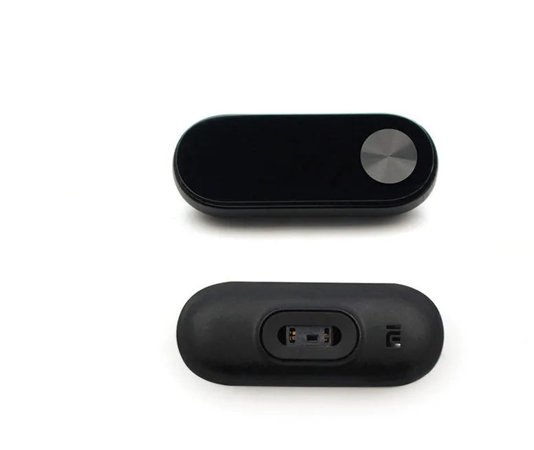 Black Xiaomi Mi Band 2 fitness tracker on wrist showing OLED screen with heart rate and step count.