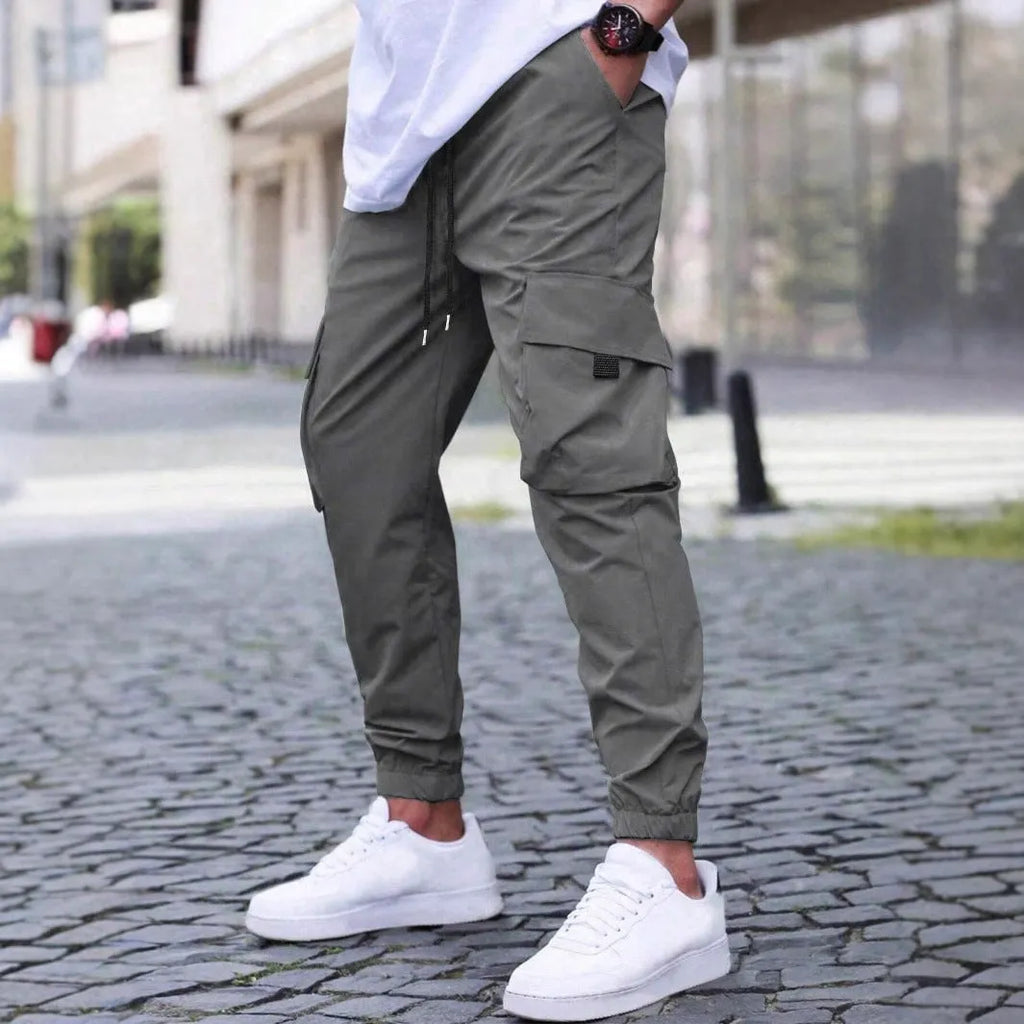 Workwear casual pants with drawstring elastic waist, solid colour, polyester fibre, skinny leg, black colour option