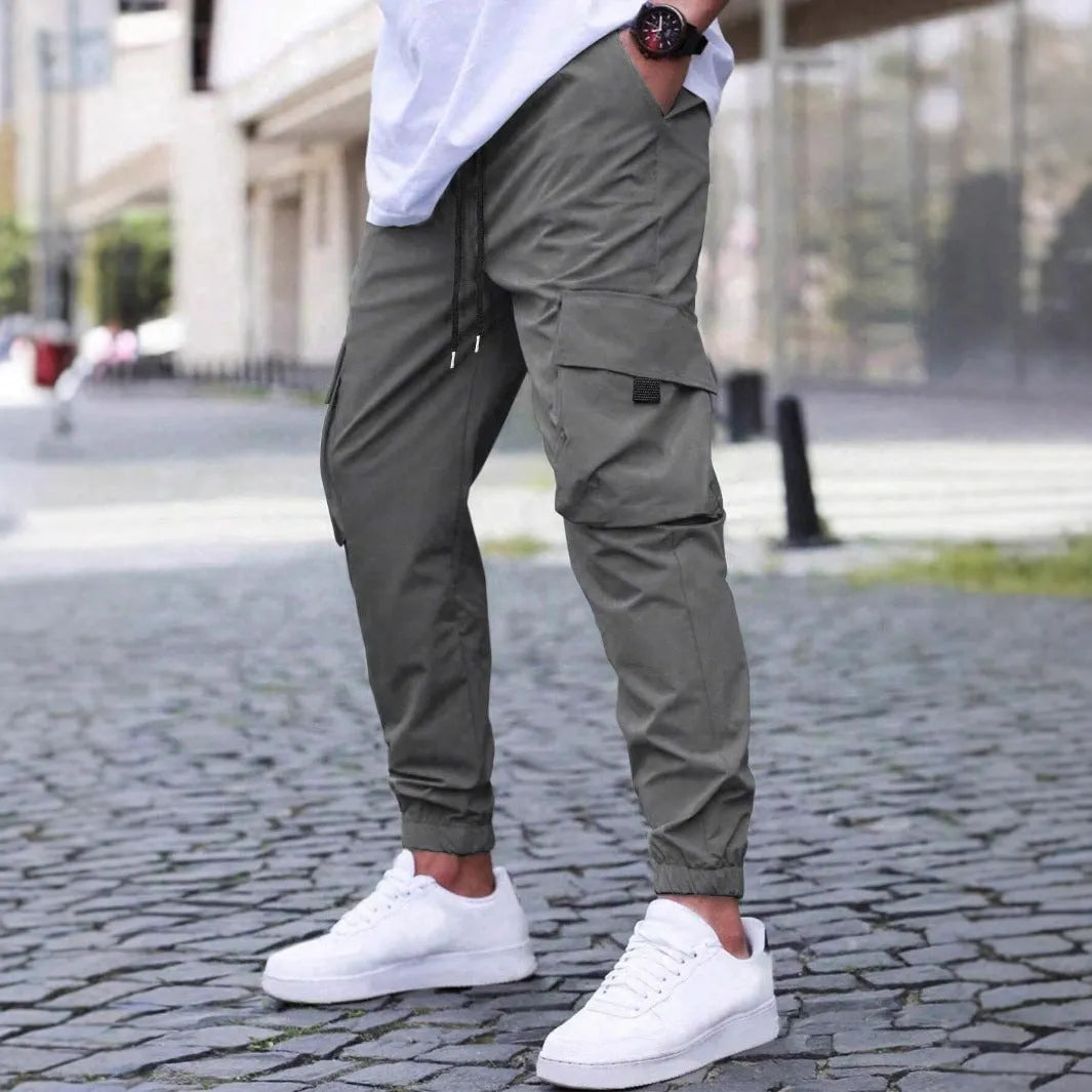 Workwear casual pants with drawstring elastic waist, solid colour, polyester fibre, skinny leg, black colour option