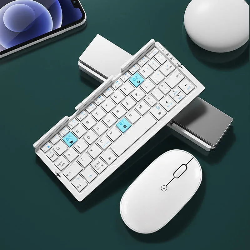 Silver aluminium folding Bluetooth keyboard open with phone on stand next to folded size comparison